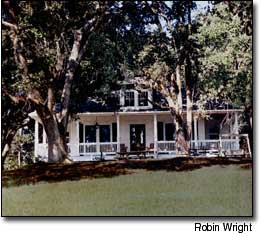 Choosing a building site with mature trees helped give the Wrights' beautiful new home the appearance of a stately, older farm home that had been updated.